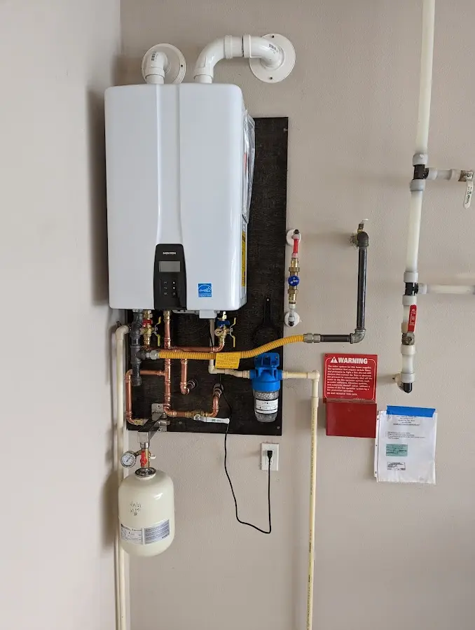 Professional plumber installing copper piping in a San Anselmo home